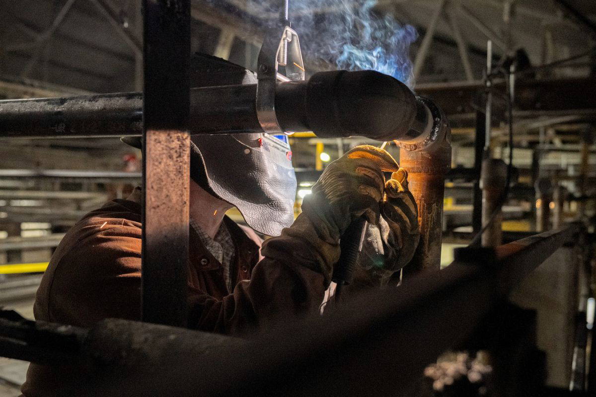 Welding a pipe joint at a customer plant